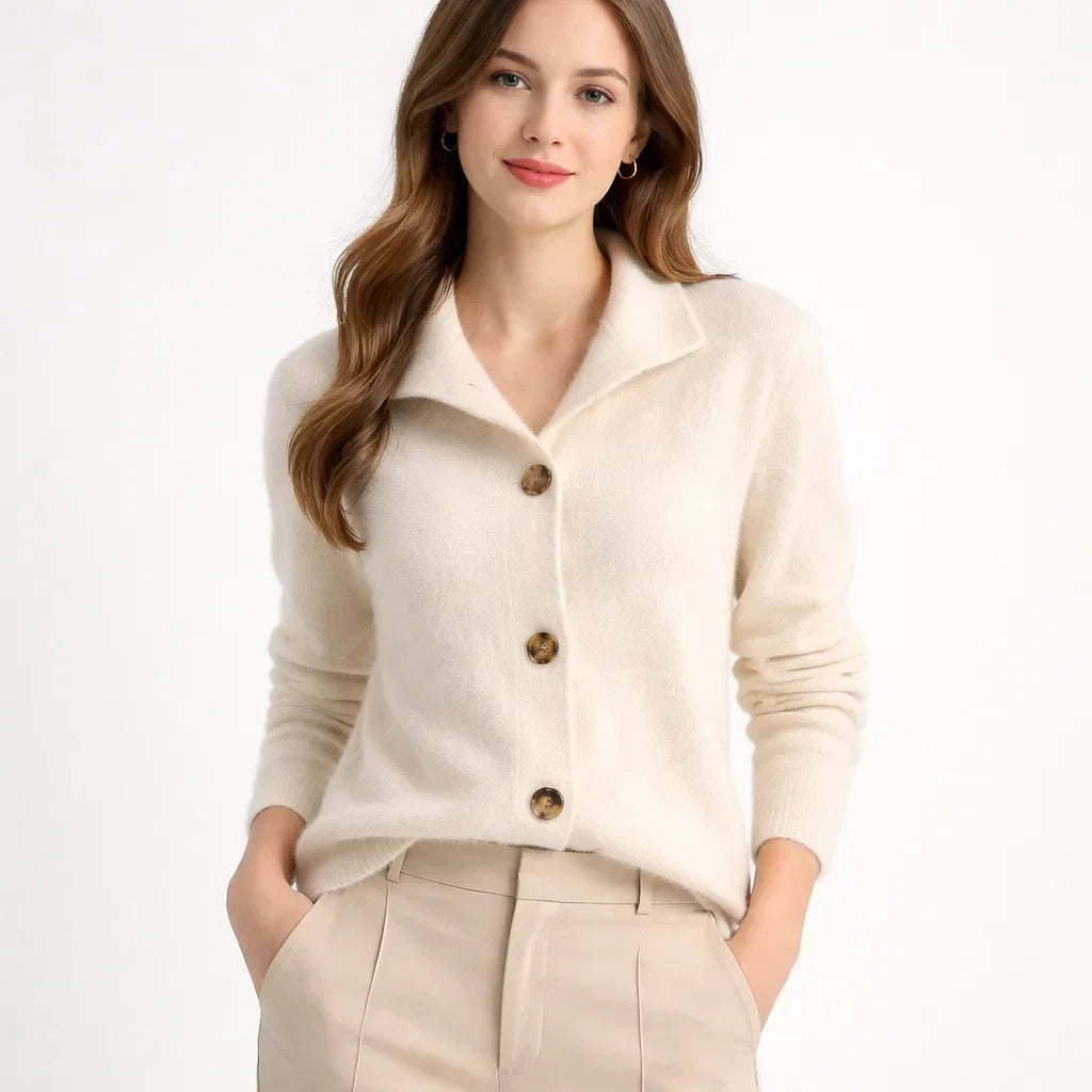 Cozy women's knit cardigan featuring an asymmetrical button placket & high neck, perfect for chic layering.