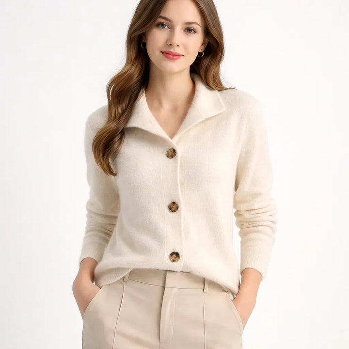 Cozy women's knit cardigan featuring an asymmetrical button placket & high neck, perfect for chic layering.