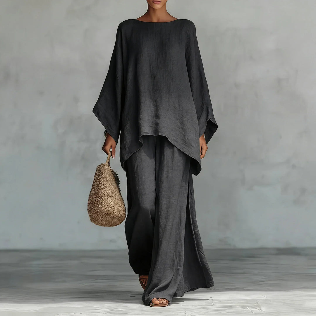 Chic women's asymmetrical two-piece set. Features a unique top & stylish wide-leg pants, ideal for summer outfits.