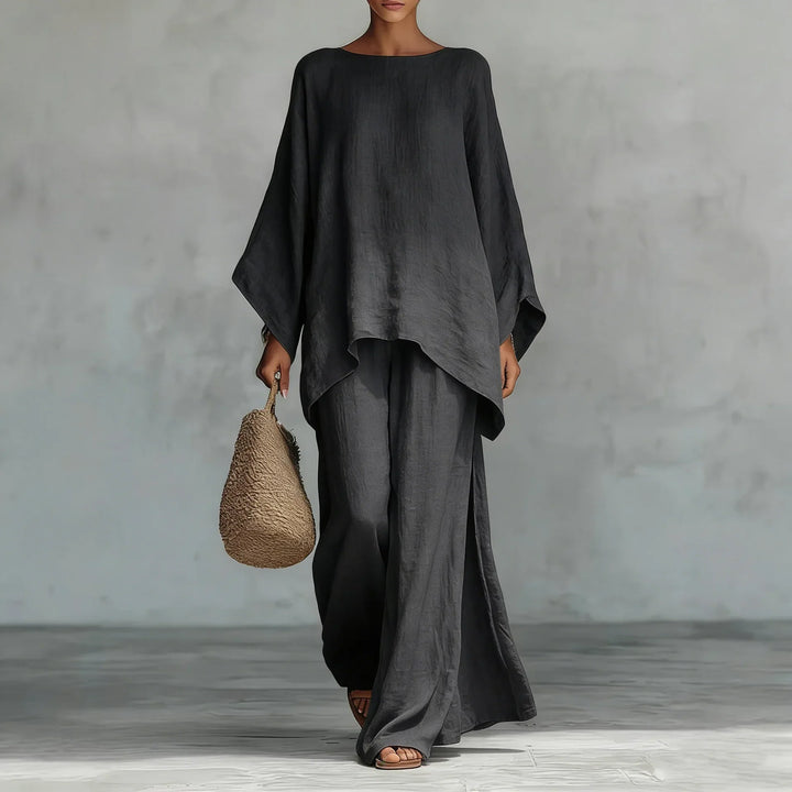 Chic women's asymmetrical two-piece set. Features a unique top & stylish wide-leg pants, ideal for summer outfits.