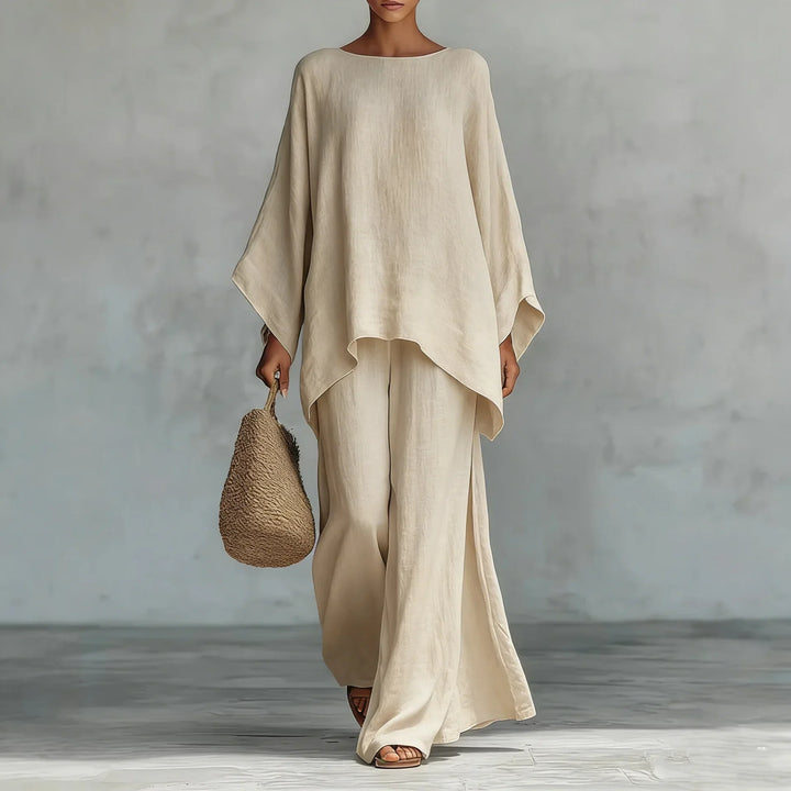 Stylish women's asymmetrical top paired with comfortable wide-leg pants. A perfect two-piece set for spring fashion.
