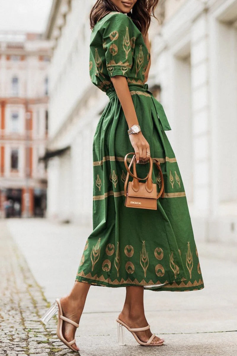 Flared midi dress for women featuring a vibrant Aztec print. Button-down front & matching belt create a chic silhouette.