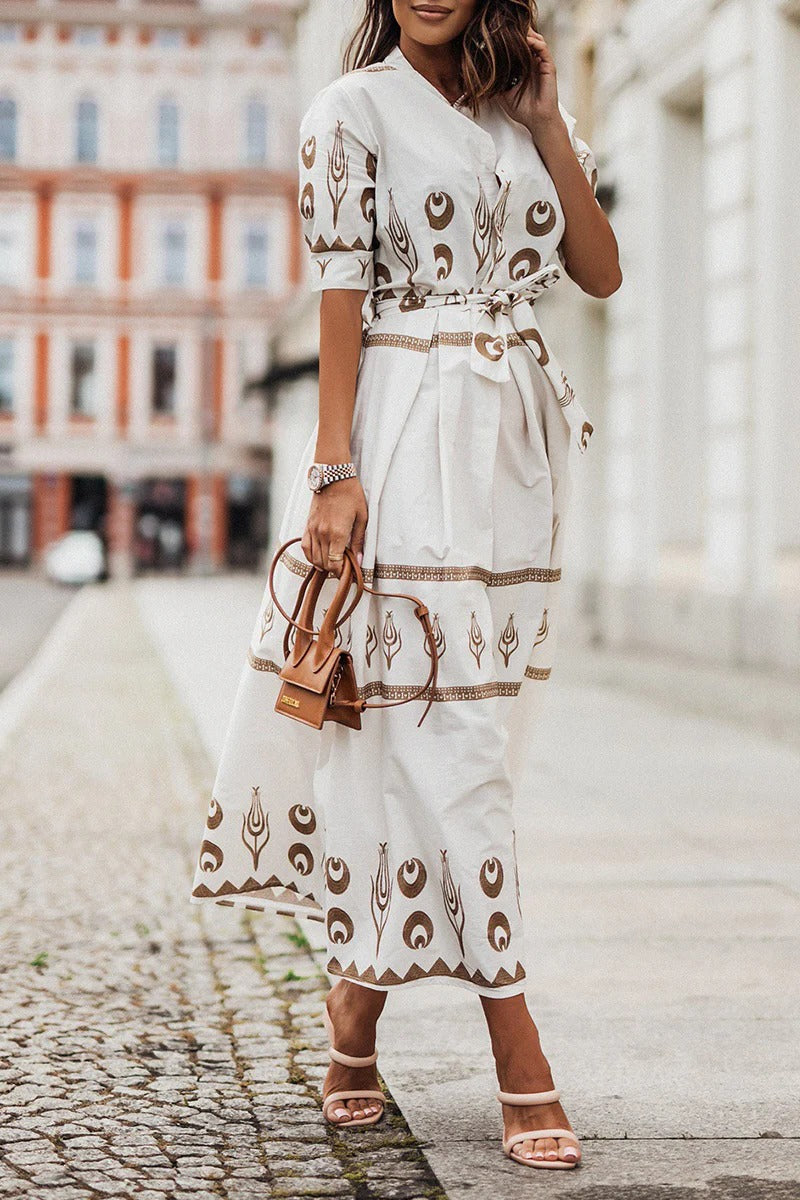 Vibrant Aztec pattern on a women's midi dress. Features button-down front, a cinching belt & a flattering flared skirt.