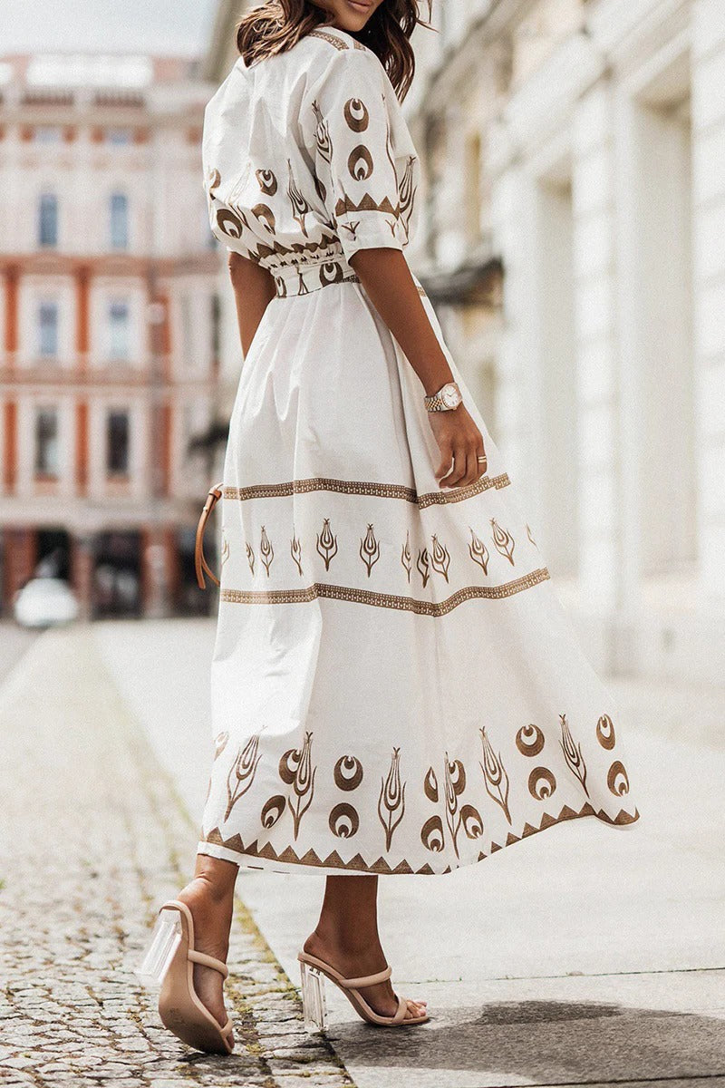 Elegant women's flared midi dress with a striking Aztec print. Button-down front & belted waist offer a tailored look.