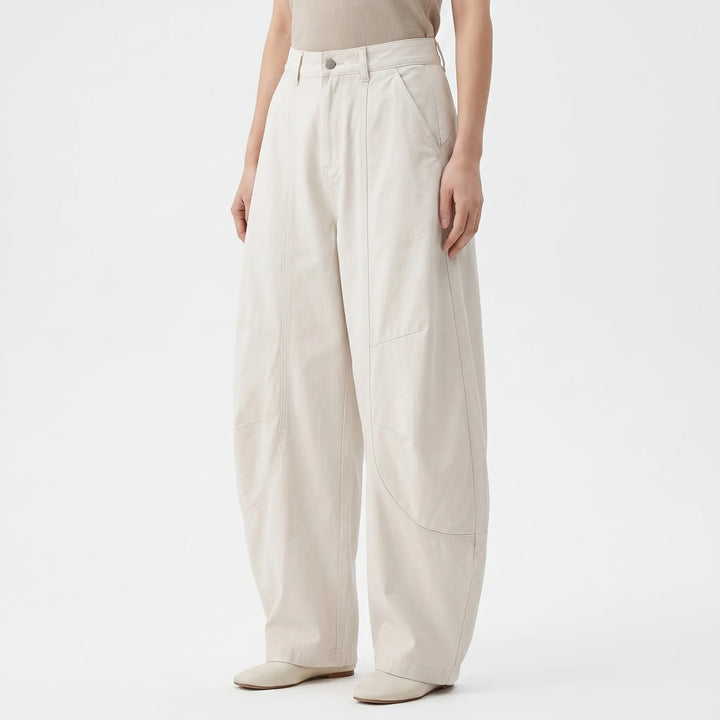 Comfortable women's loose fit barrel-leg pants. Stylish low-rise baggy jeans, great for casual wear.
