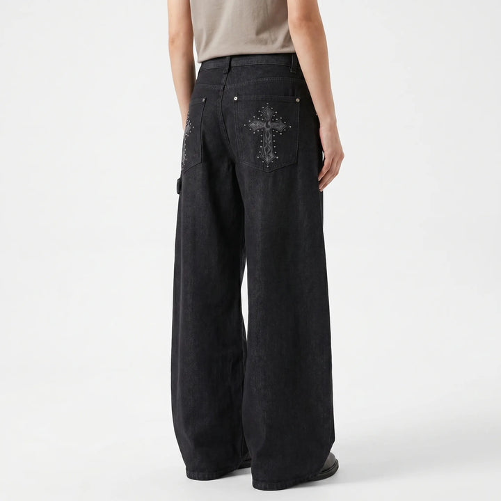 Low-rise women's baggy wide-leg jeans with a cool studded cross, perfect for an alternative style statement.