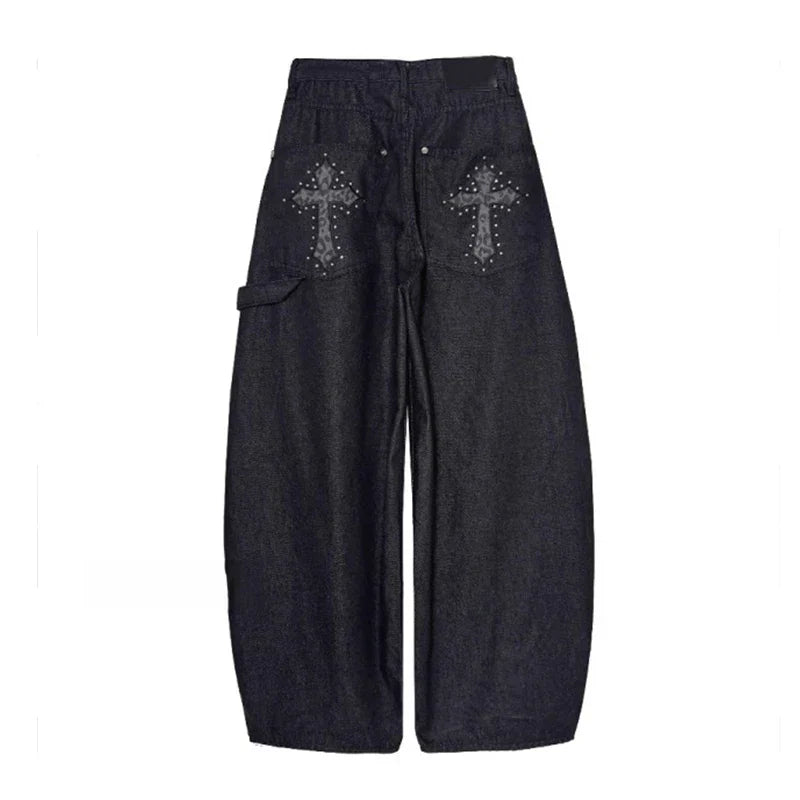 Fashionable women's baggy wide-leg pants, low-rise with a bold studded cross, embracing alternative & streetwear.