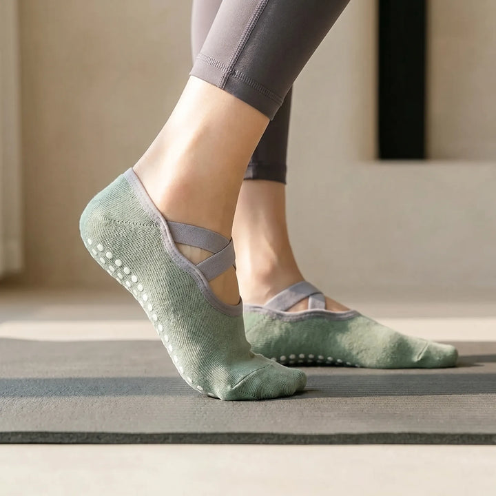 Women's ballet-style non-slip grip socks for yoga & barre workouts. Enhance stability & comfort in green.