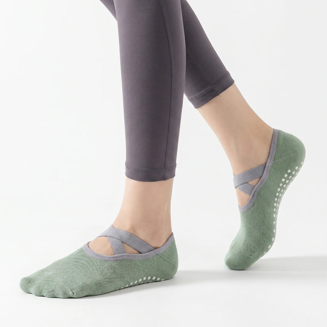 Green women's grip socks, perfect for Pilates, yoga & studio fitness. Non-slip activewear for secure workouts.