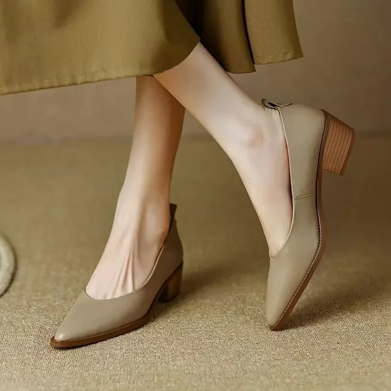 Women's beige pointed toe slip-on block heel court shoes, elegant & comfortable for versatile wear.