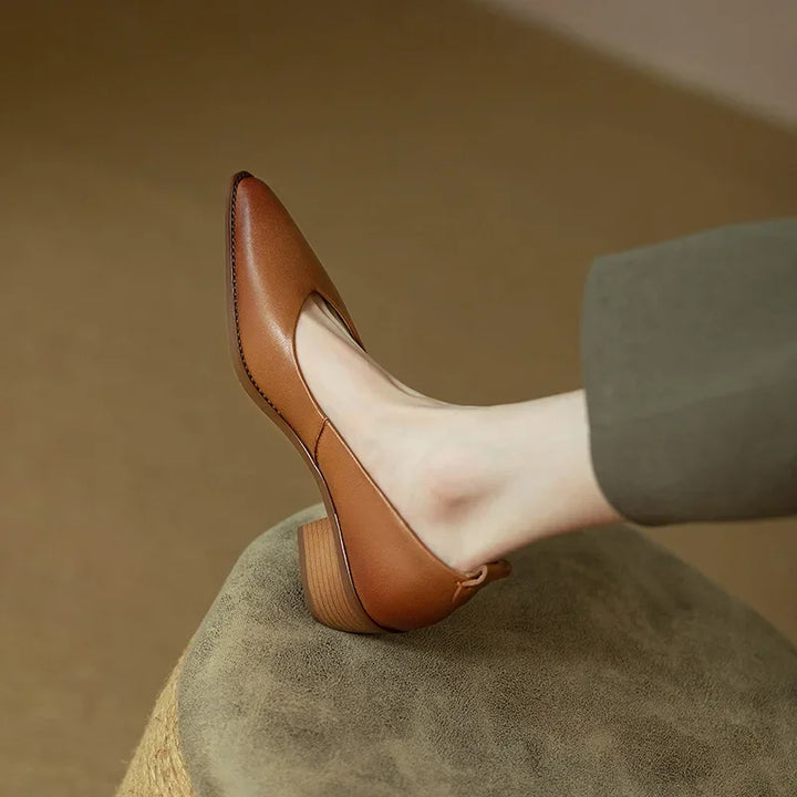 Versatile women's beige pointed toe block heel court shoes for work, office, or elegant events.
