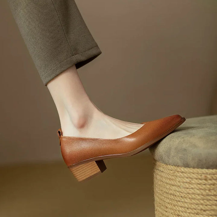 Easy slip-on women's pointed toe block heel court shoes, combining style, comfort & convenience.