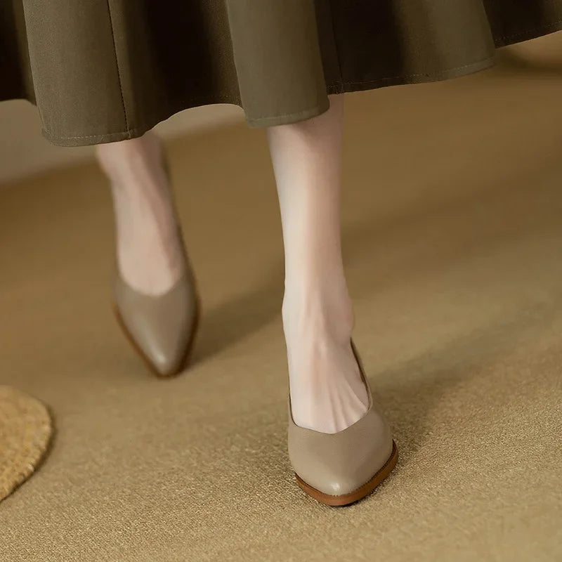 Elegant women's pointed toe block heel court shoes, ideal for office or sophisticated smart casual looks.