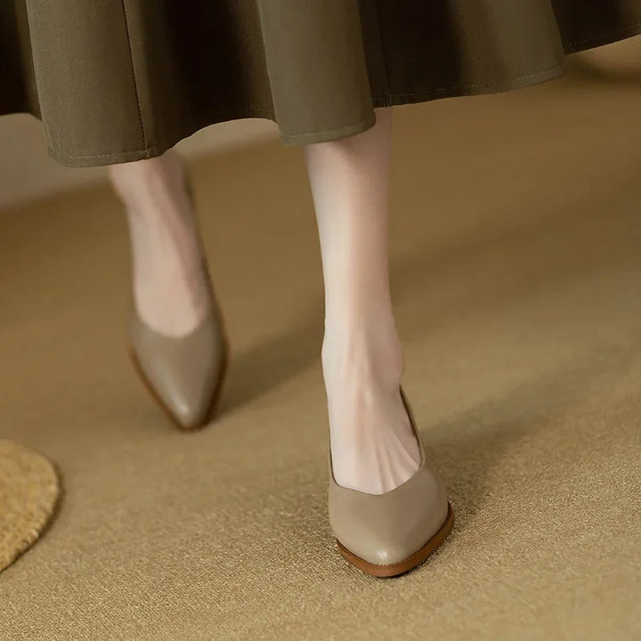 Elegant women's pointed toe block heel court shoes, ideal for office or sophisticated smart casual looks.