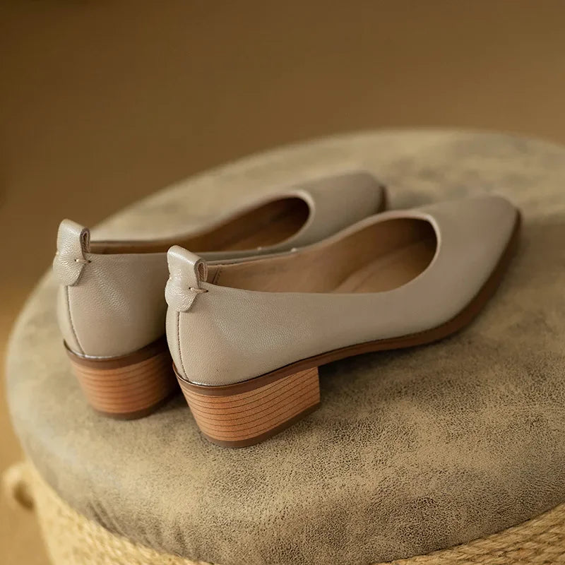 Sleek pointed toe design on women's beige block heel court shoes, adds sophistication to any outfit.