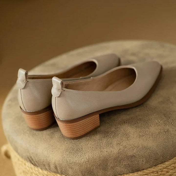 Sleek pointed toe design on women's beige block heel court shoes, adds sophistication to any outfit.