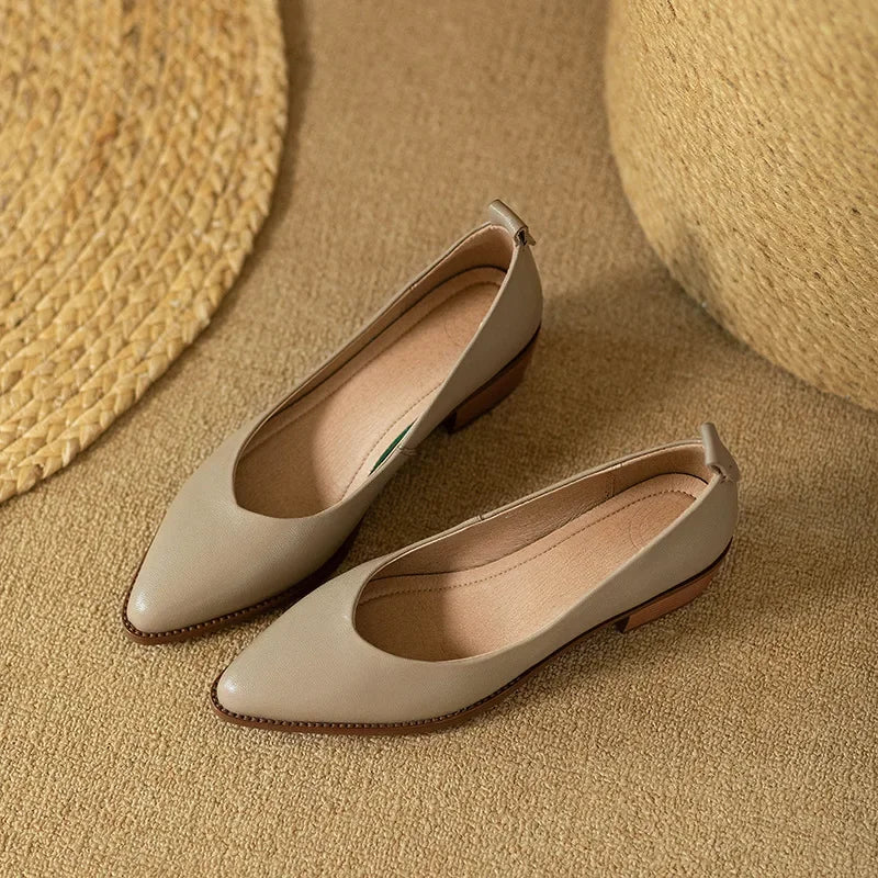 Smooth finish on women's slip-on block heel court shoes, elegant & comfortable for office or chic events.