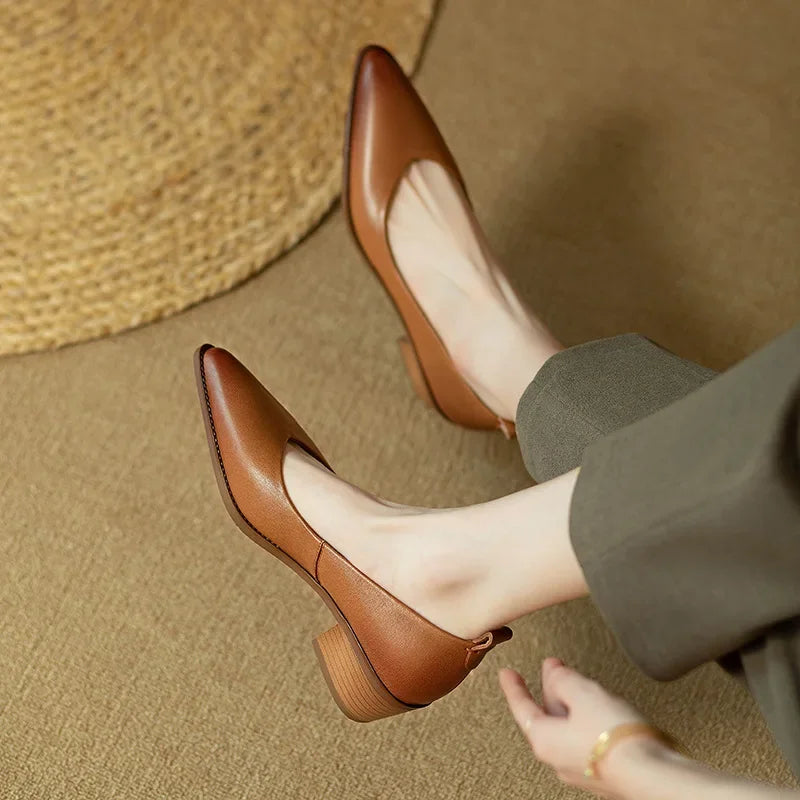 Stylish women's pointed toe block heel court shoes, great for smart casual or professional office attire.