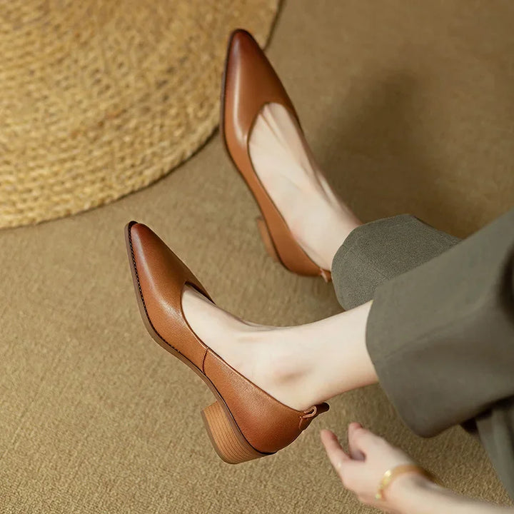 Stylish women's pointed toe block heel court shoes, great for smart casual or professional office attire.