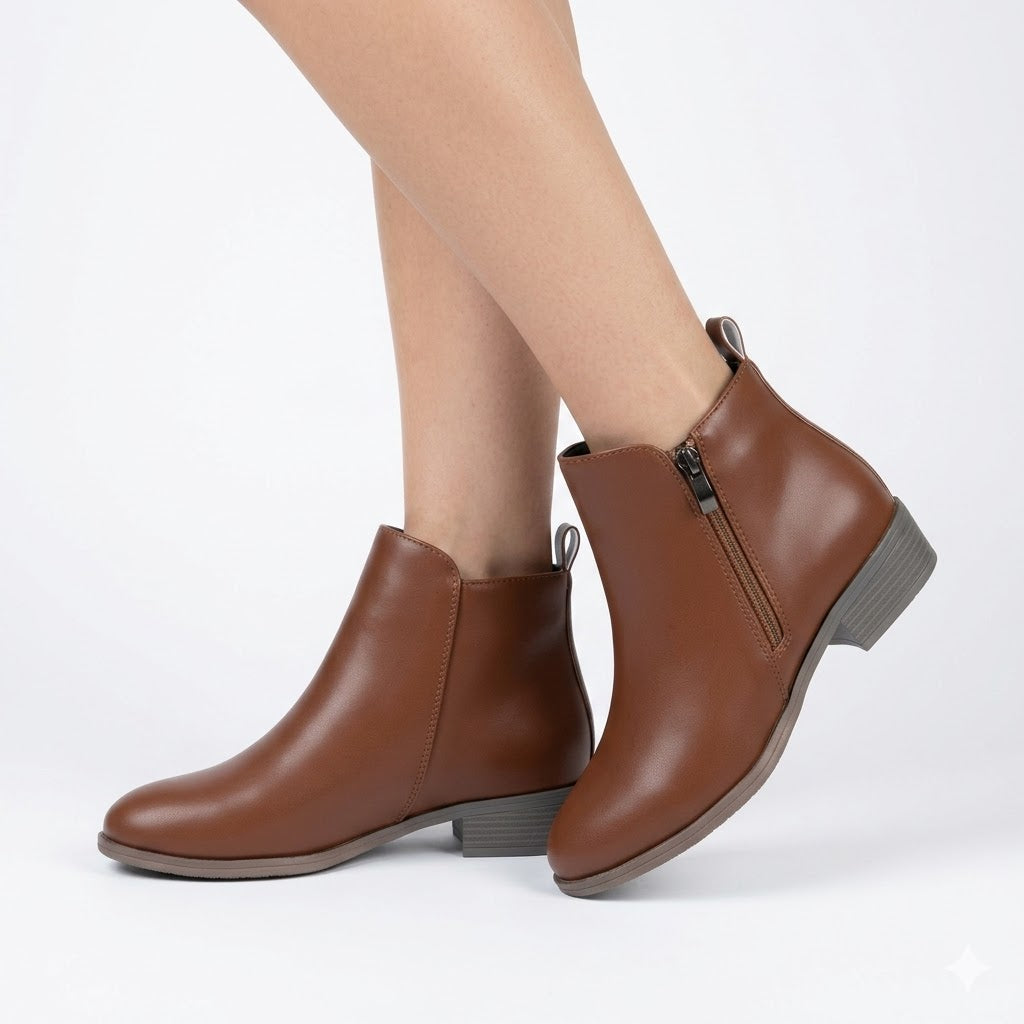 Women's black ankle boots with a stylish block heel & convenient side zip for casual or workwear outfits.