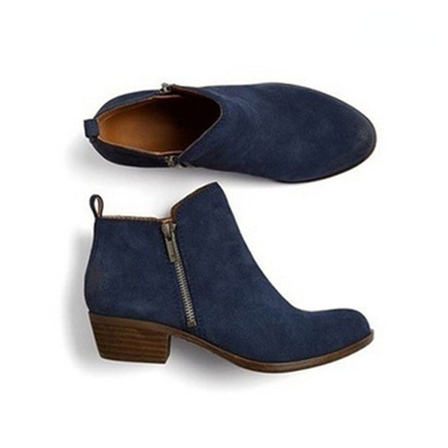Side zip closure on women's elegant black ankle boots, perfect for easy on/off & a sleek look.