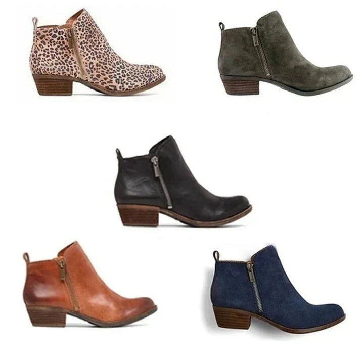 Faux leather women's ankle boots with a rounded toe, block heel, and side zip, ideal for casual fashion.