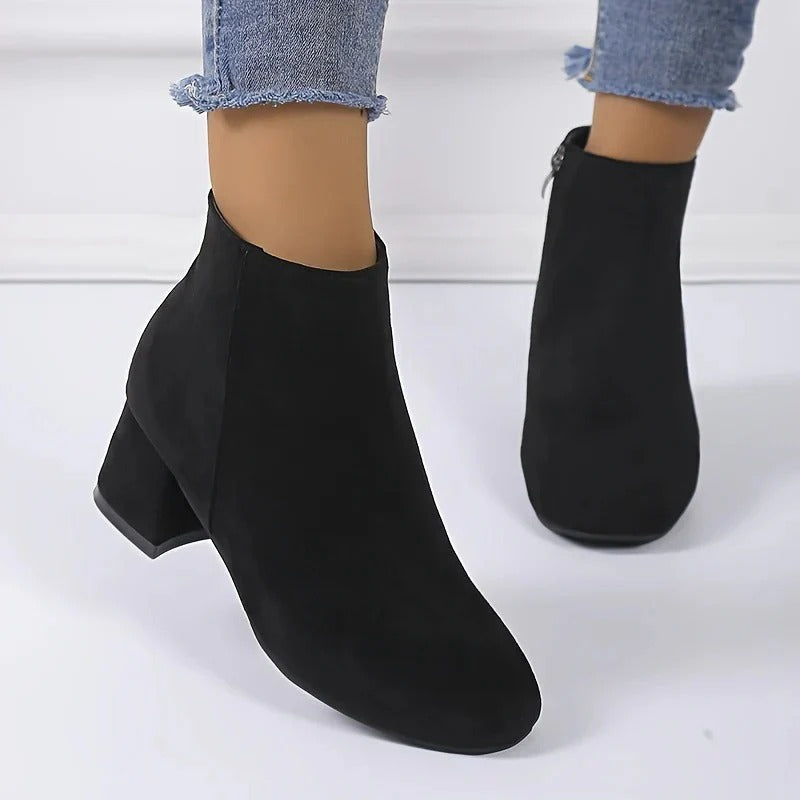 Versatile women's casual ankle boots with a chic block heel and convenient side zip, great for any outfit.