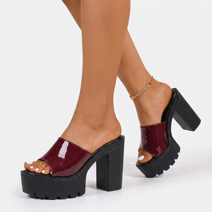 Glossy black women's platform sandals with comfortable chunky block heels & slip-on design for summer.
