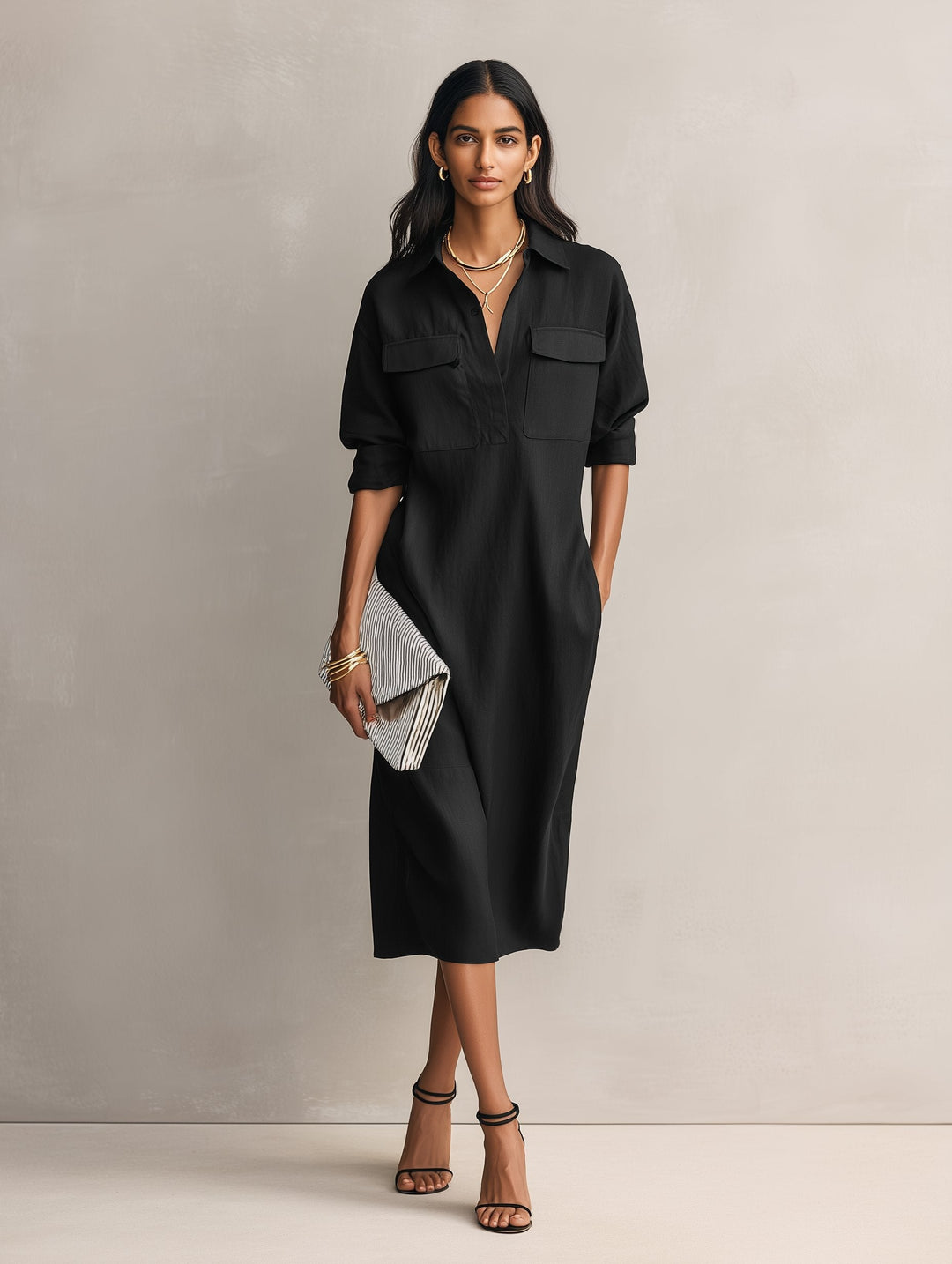Casual women's black shirt dress with a stylish collar and elbow-length sleeves. Comfortable midi length.