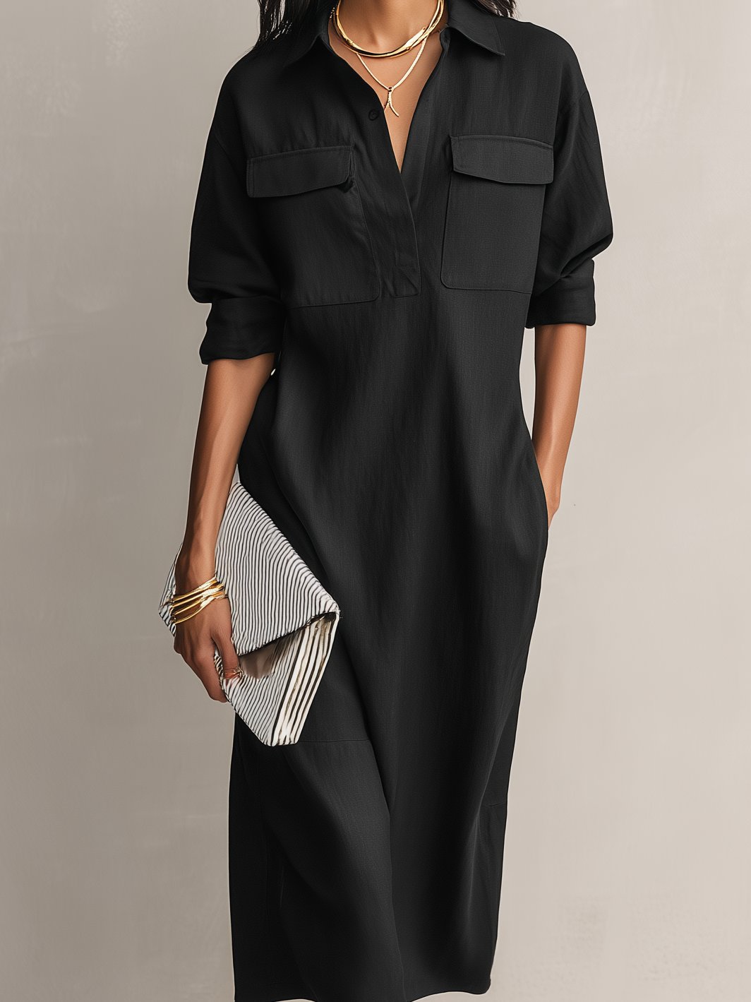Elegant black collared midi dress for women, styled as a shirt dress with elbow sleeves. Casual and chic.