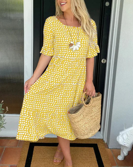 Chic women's dotted midi dress, featuring a relaxed fit and versatile design for comfortable everyday wear.