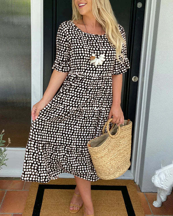 Comfortable women's relaxed fit midi dress with dotted print, ideal for casual spring & summer outfits.