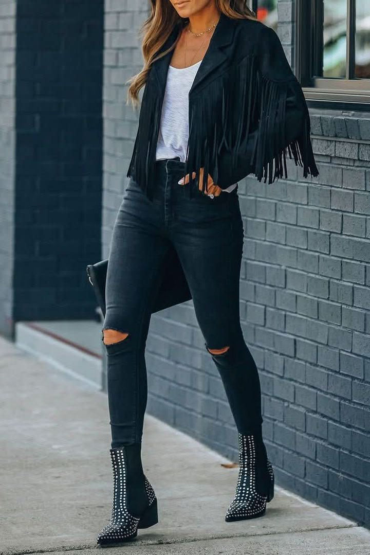 Stylish women's fringed moto jacket in orange, a bold fashion statement piece for any edgy look.