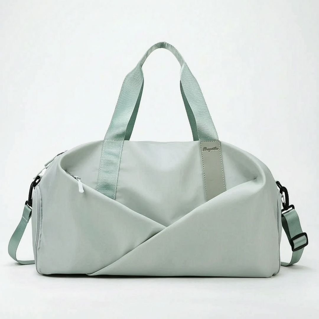 Spacious women's workout duffel bag with a separate shoe compartment, designed for gym and sports activities.
