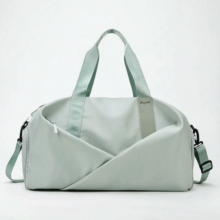 Spacious women's workout duffel bag with a separate shoe compartment, designed for gym and sports activities.