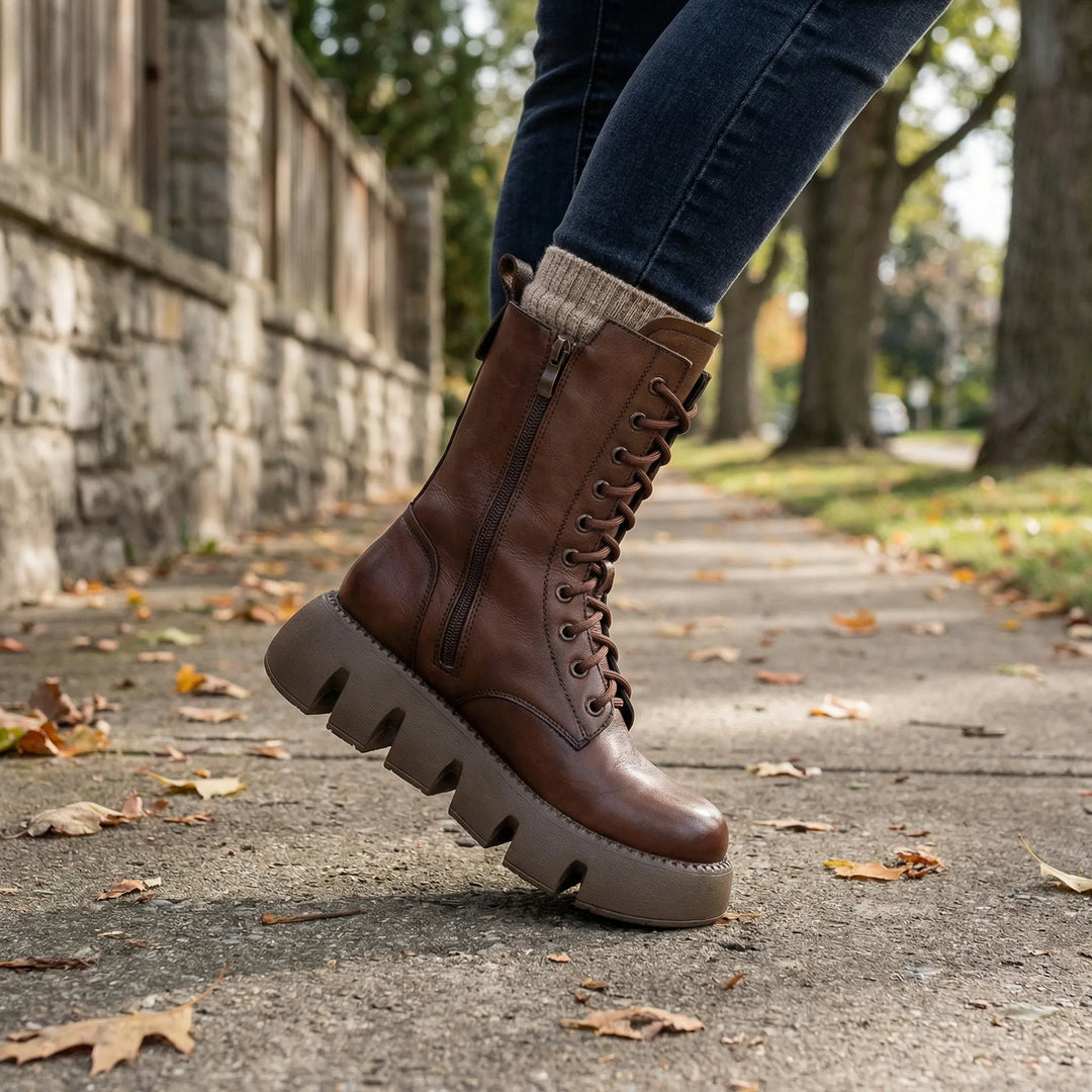 Women's black lace-up platform combat boots with arch support for comfortable everyday walking.