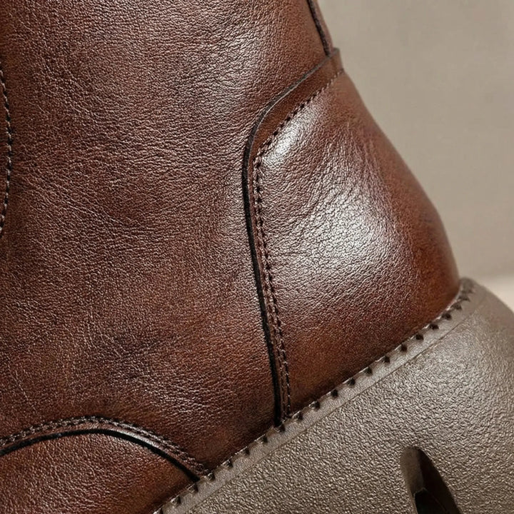 Durable women's combat boots, non-slip platform sole, lace-up closure & arch support for all-day wear.