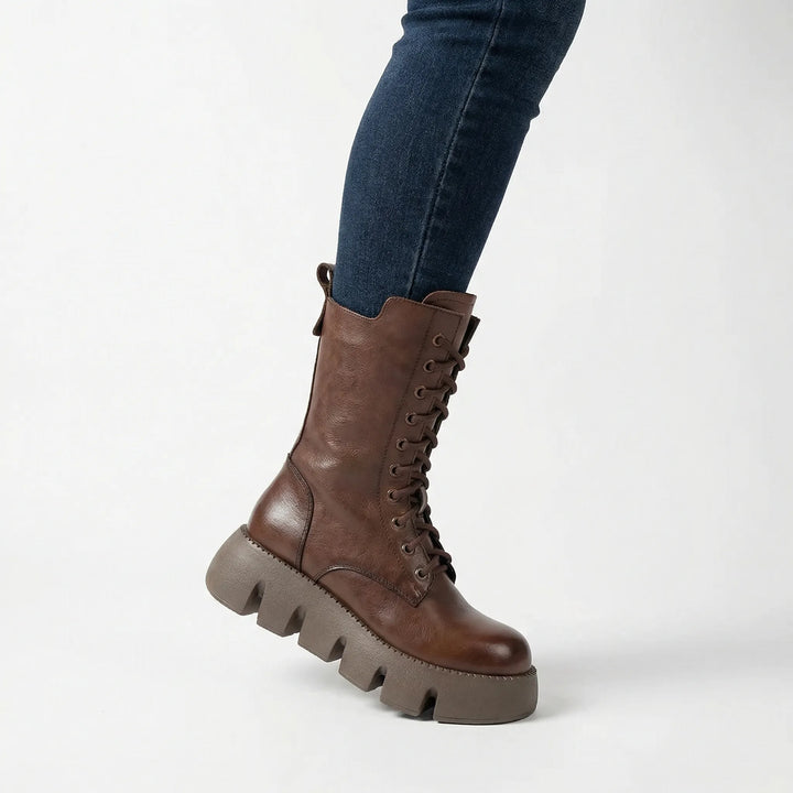 Chic black women's platform combat boots with full lace-up front and integrated arch support for comfort.