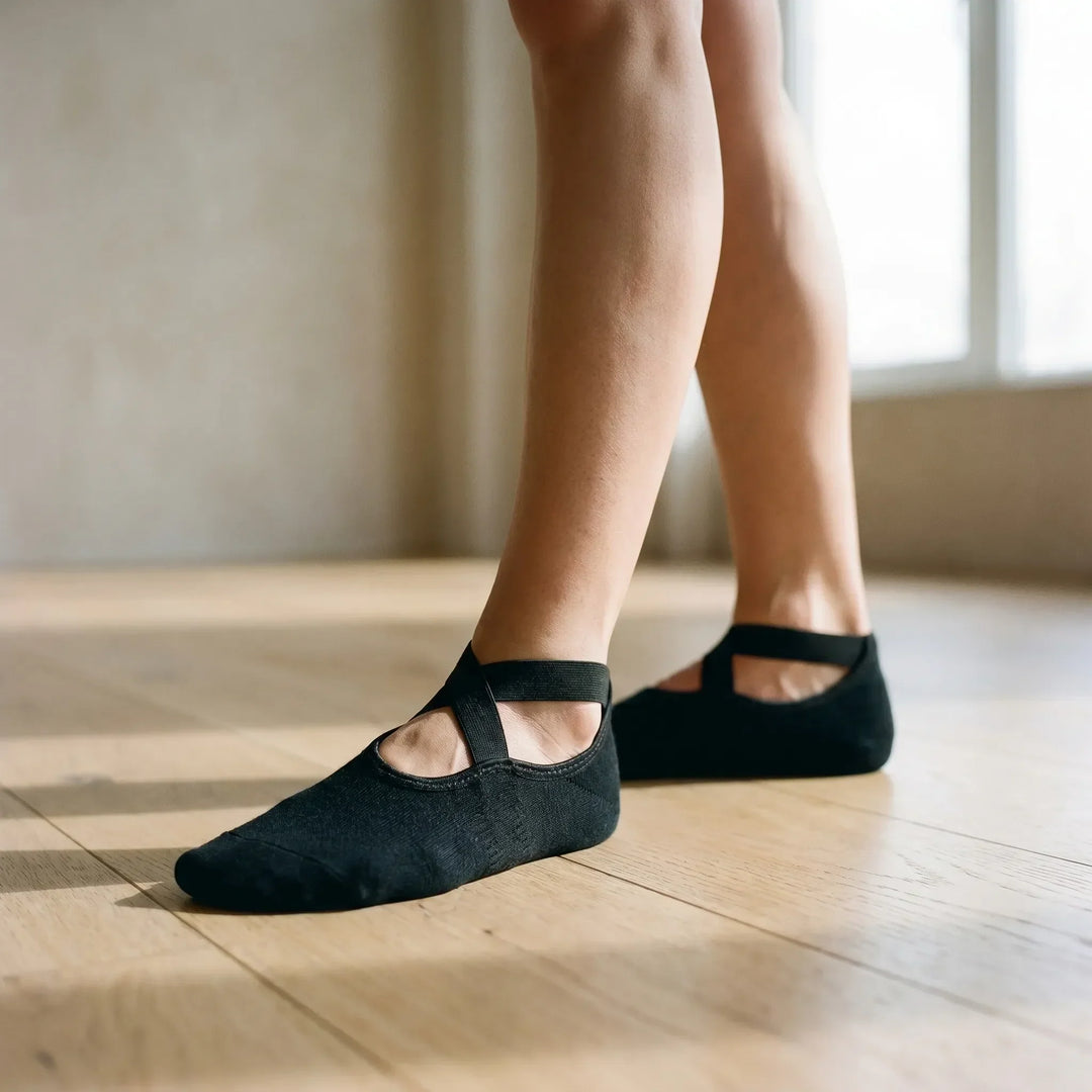 Women's black non-slip yoga socks with grip for studio pilates & barre workouts.