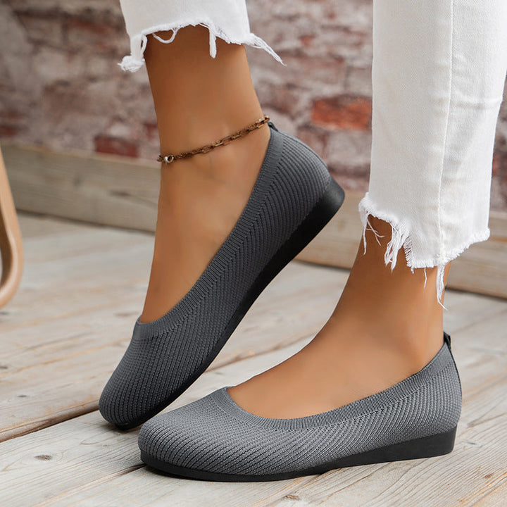 Front view of women's stylish orthopedic flats, comfortable beige ballerinas for everyday wear.