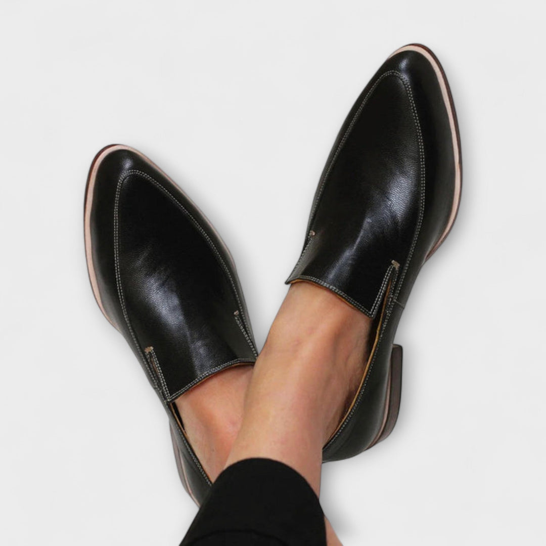 Women's black orthopedic loafers for all-day comfort, arch support, and classic casual or formal wear. Slip-on.