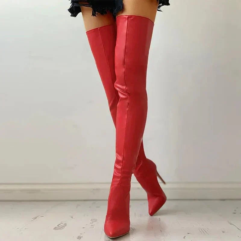Fashionable women's over-the-knee dress boots, black, with a sharp pointed toe & high stiletto heel.