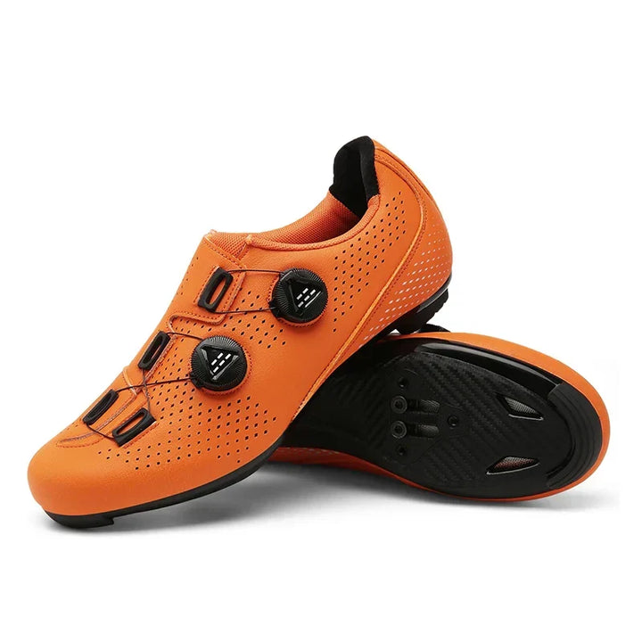 Women's orange clipless cycling shoes with secure fit & breathability for road & MTB outdoor performance.