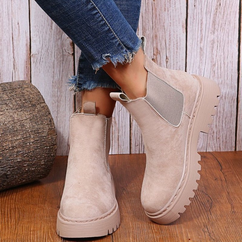 Women's black platform Chelsea boots. Chunky sole, elastic sides & pull-on style ankle boots for modern casual wear.