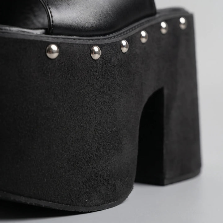 Tall black platform sandals for women, featuring a high block heel. Ideal party & fashion footwear.