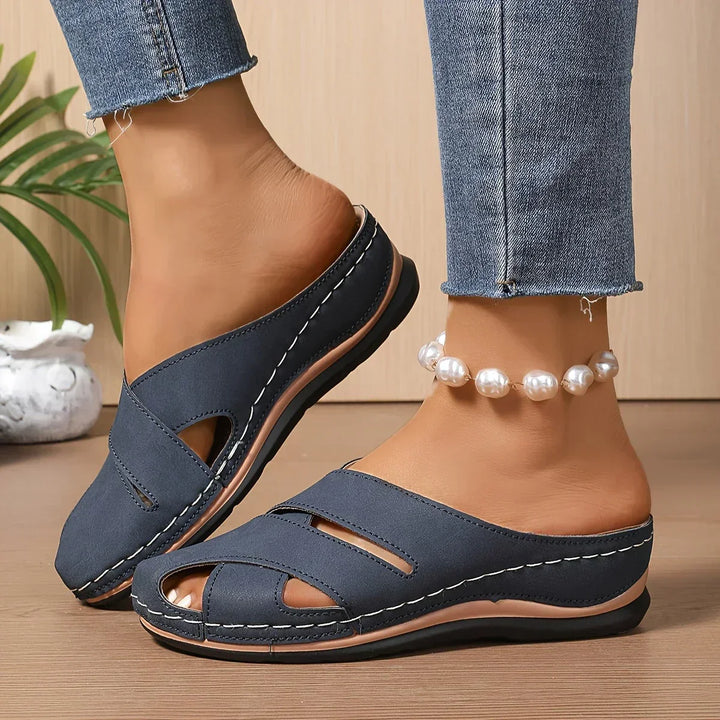 Women's black platform wedge sandals, offering all-day comfort and stylish elevated support for summer.