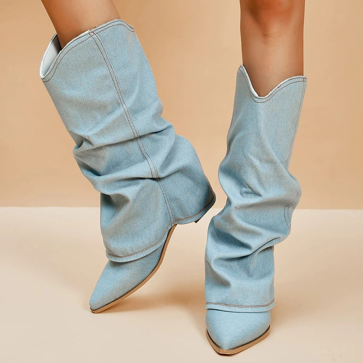 Women's black pleated tall block heel boots with a sleek pointed toe, perfect for elegant fall fashion.