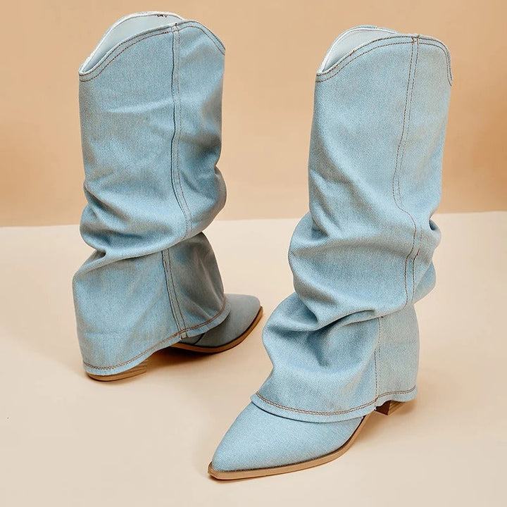 Tall women's fashion boots with pleated details, pointed toe, and sturdy block heel for a chic fall look.