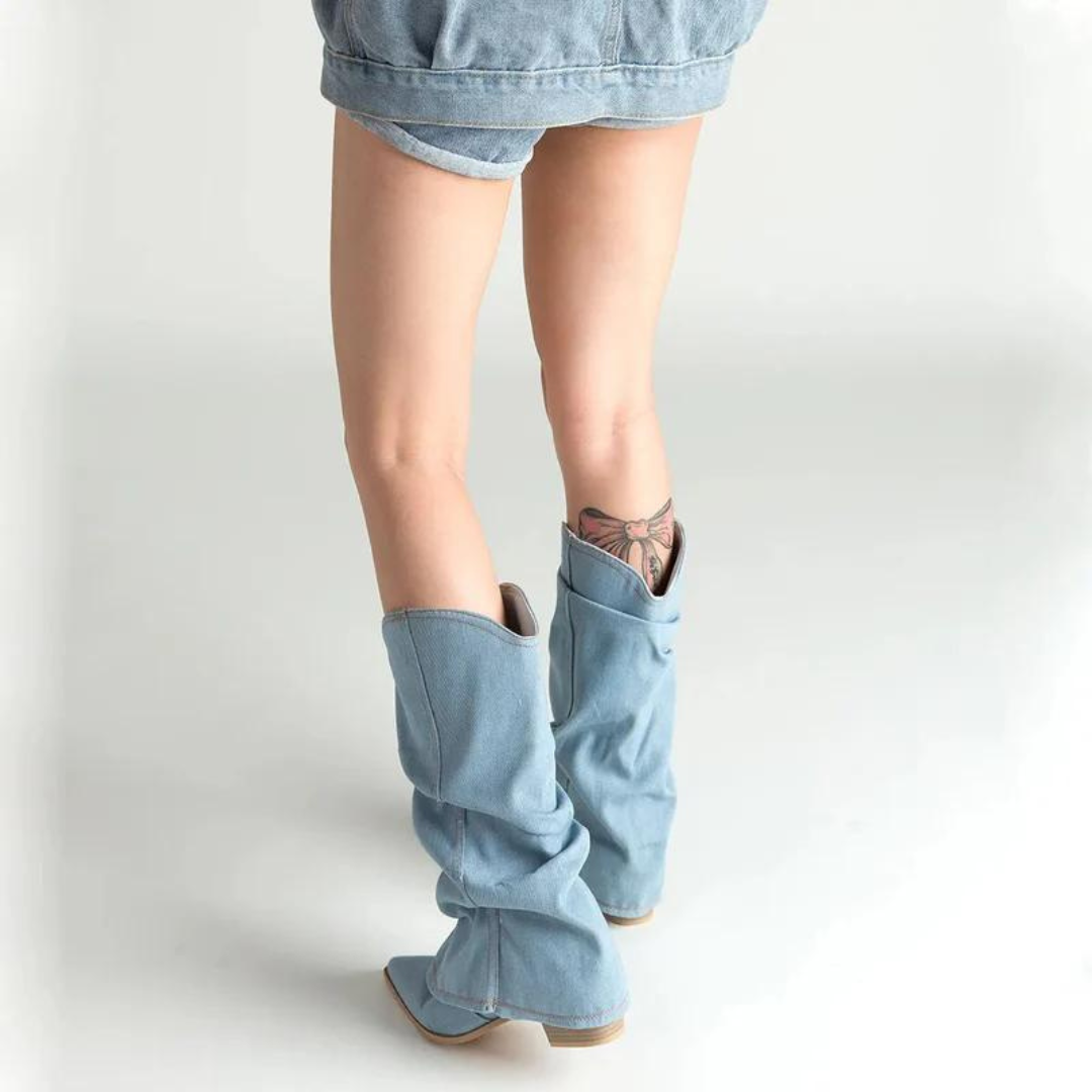 Sophisticated pleated women's boots with a sharp pointed toe and stable block heel for elegant footwear.
