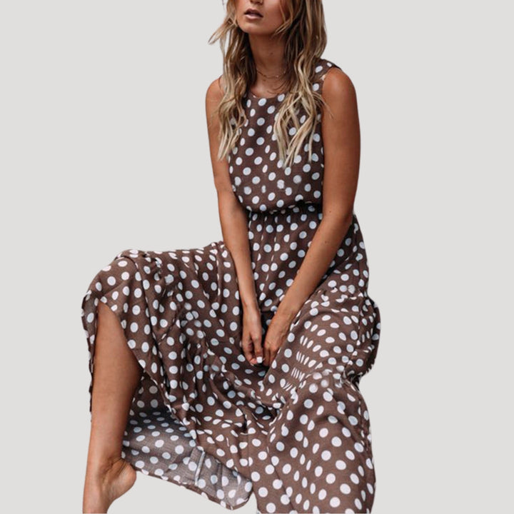 Women's black polka dot sleeveless midi A-line sundress, perfect for summer casual elegance.